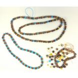 SARAWAK POLYCHROME GLASS BEAD NECKLACE (L. 150 CM APPROX.), A SHORTER BEAD NECKLACE (L. 65 CM