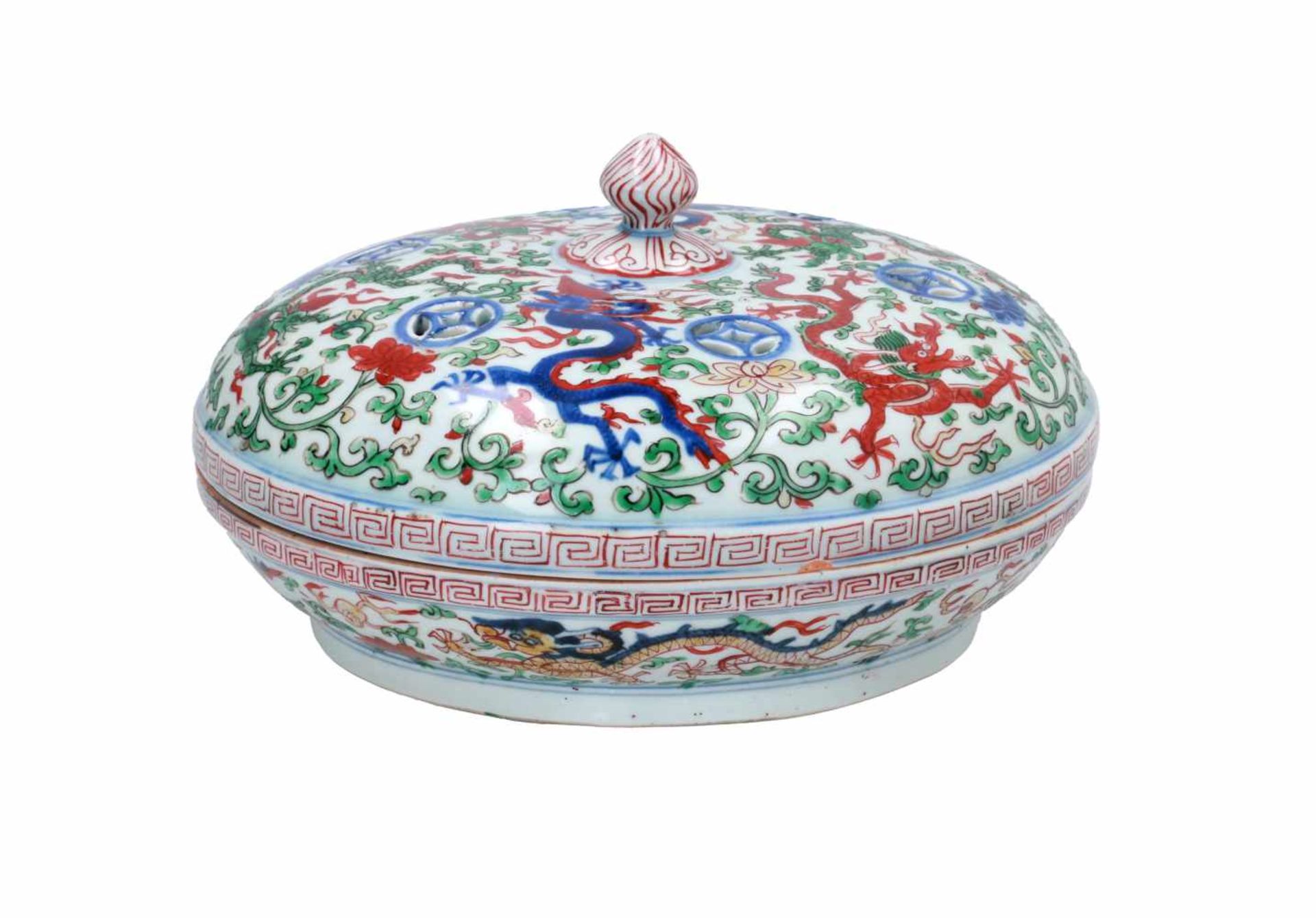 A Wucai porcelain lidded bowl, decorated with dragons and flowers. The bowl with nine