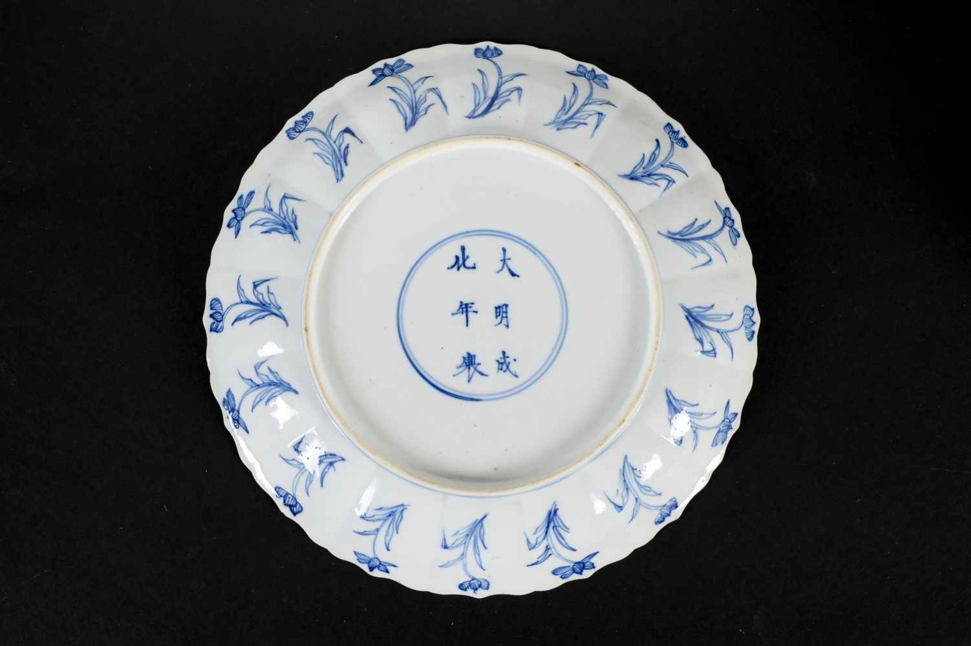 A lobed blue and white porcelain deep dish with scalloped rim, decorated with flowers and two long - Image 2 of 3