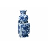 A blue and white porcelain wall vase, decorated with flowers, butterflies and censers. Marked with