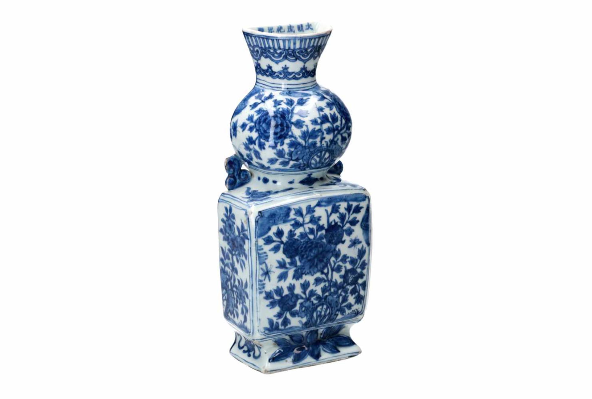 A blue and white porcelain wall vase, decorated with flowers, butterflies and censers. Marked with