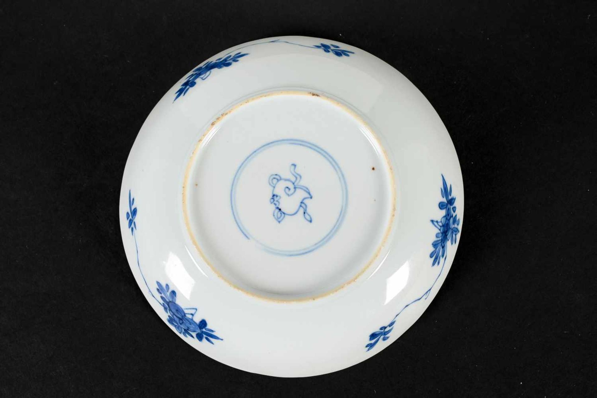 A blue and white porcelain lidded cup with two handles on a deep saucer, decorated with flowers. - Image 4 of 9