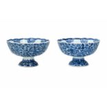 A pair of blue and white porcelain tazzas, decorated with flowers. Marked with symbol. China,