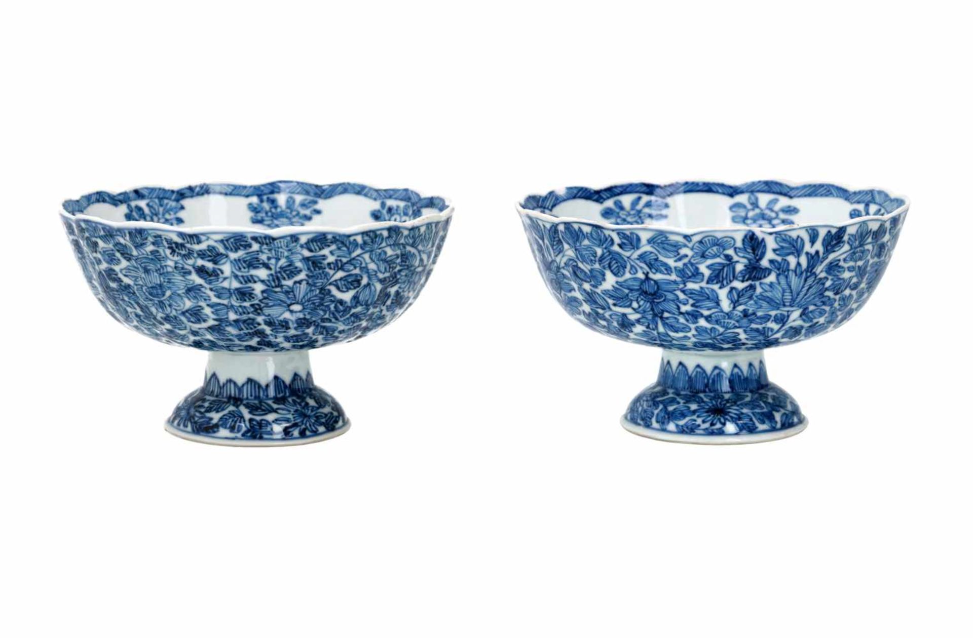 A pair of blue and white porcelain tazzas, decorated with flowers. Marked with symbol. China,
