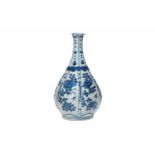 A lobed blue and white porcelain vase, decorated with flowers and fruits. Unmarked. China, Wanli.