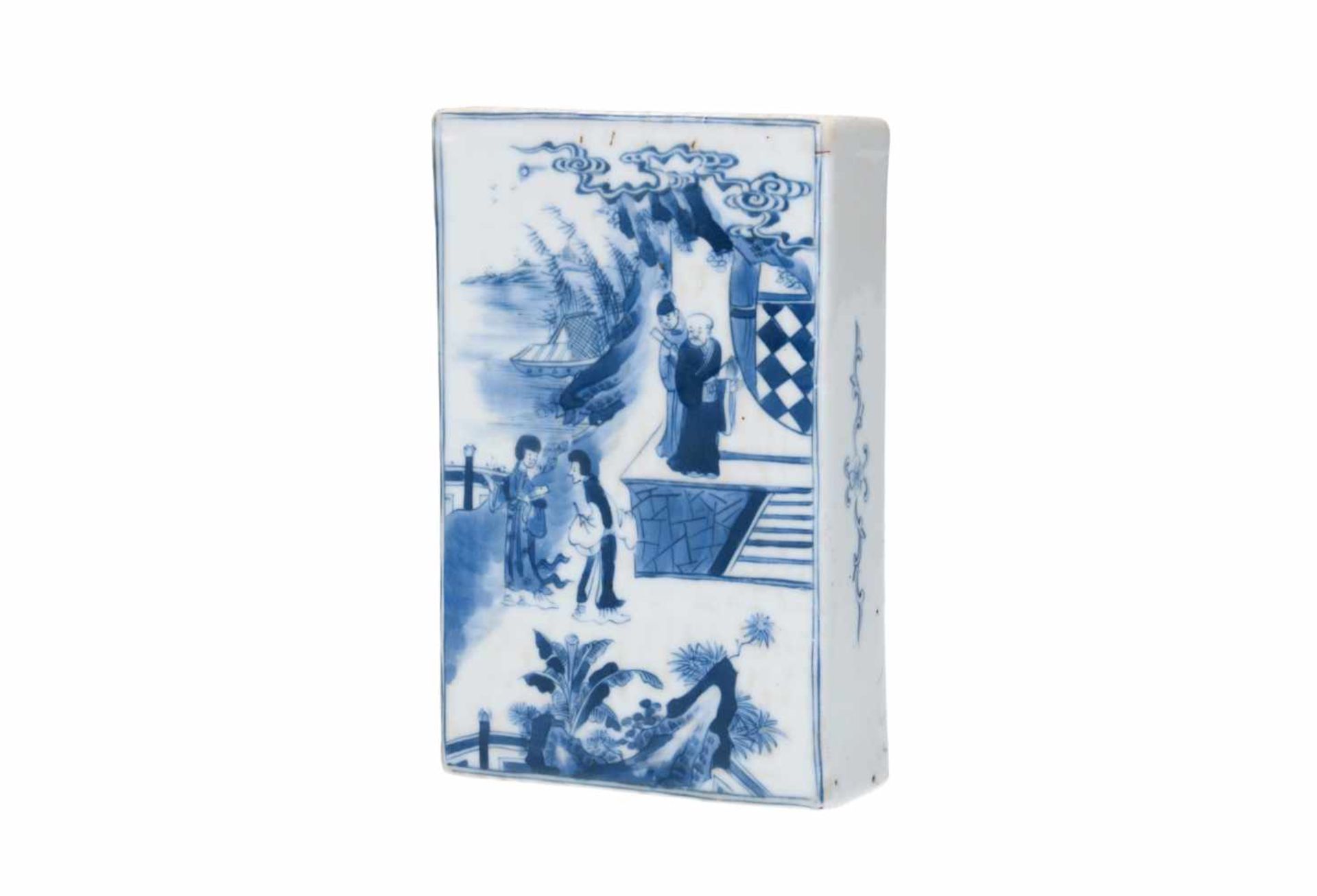 A blue and white porcelain book weight, decorated with a scene of the novel 'Romance of the