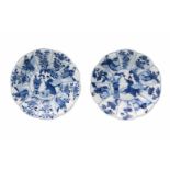 A pair of lobed blue and white porcelain deep dishes with scalloped rim, decorated with long