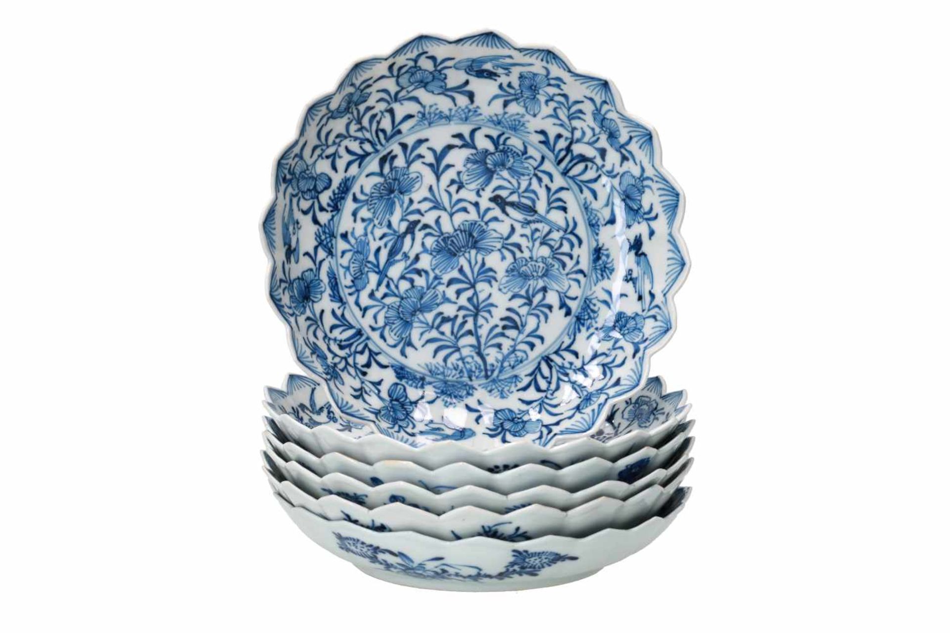 A set of six blue and white porcelain deep saucers with scalloped rim, decorated with flowers and