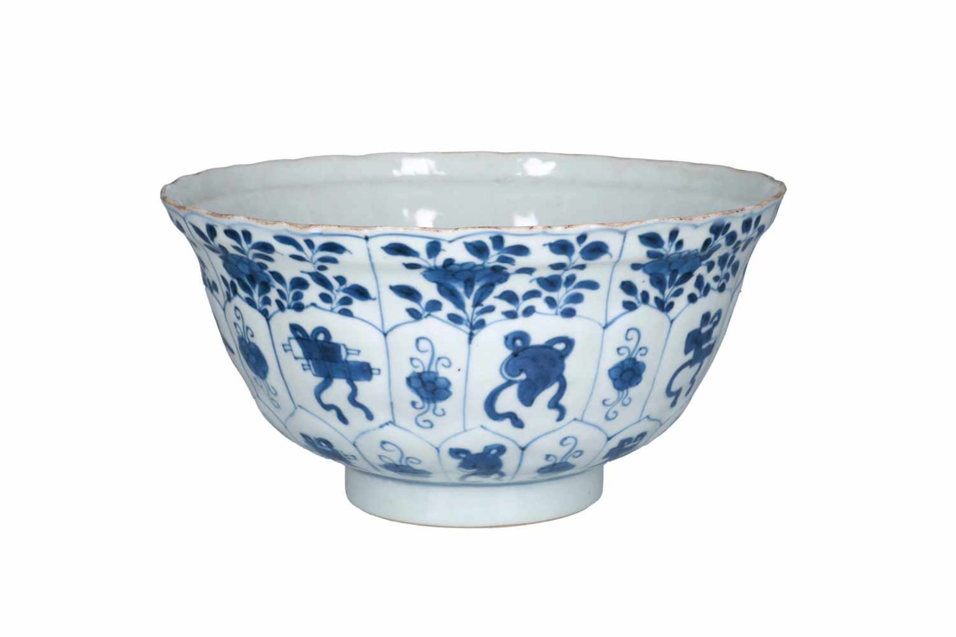 A blue and white porcelain bowl, decorated with flowers and antiquities. The center with three