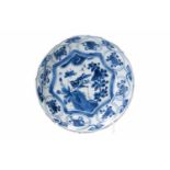 A blue and white 'kraak' porcelain dish, decorated with flowers, a butterfly and a cricket.