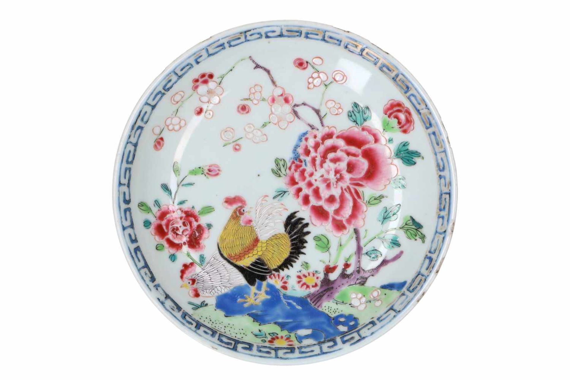 A famille rose porcelain chicken saucer, decorated with flowers. Unmarked. China, Qianlong.