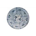A blue and white porcelain deep charger, decorated with dragons and flowers. Unmarked. China,