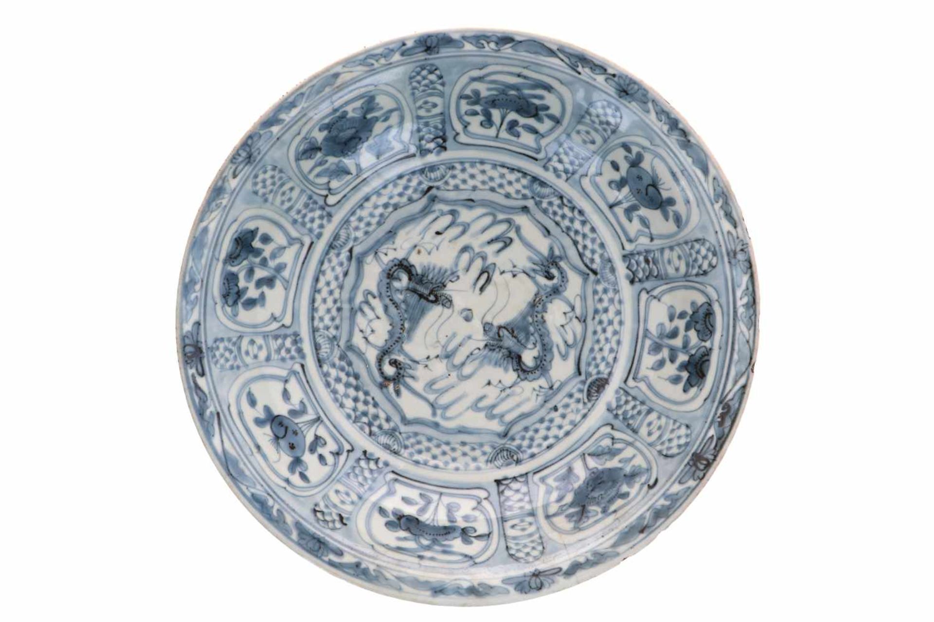 A blue and white porcelain deep charger, decorated with dragons and flowers. Unmarked. China,