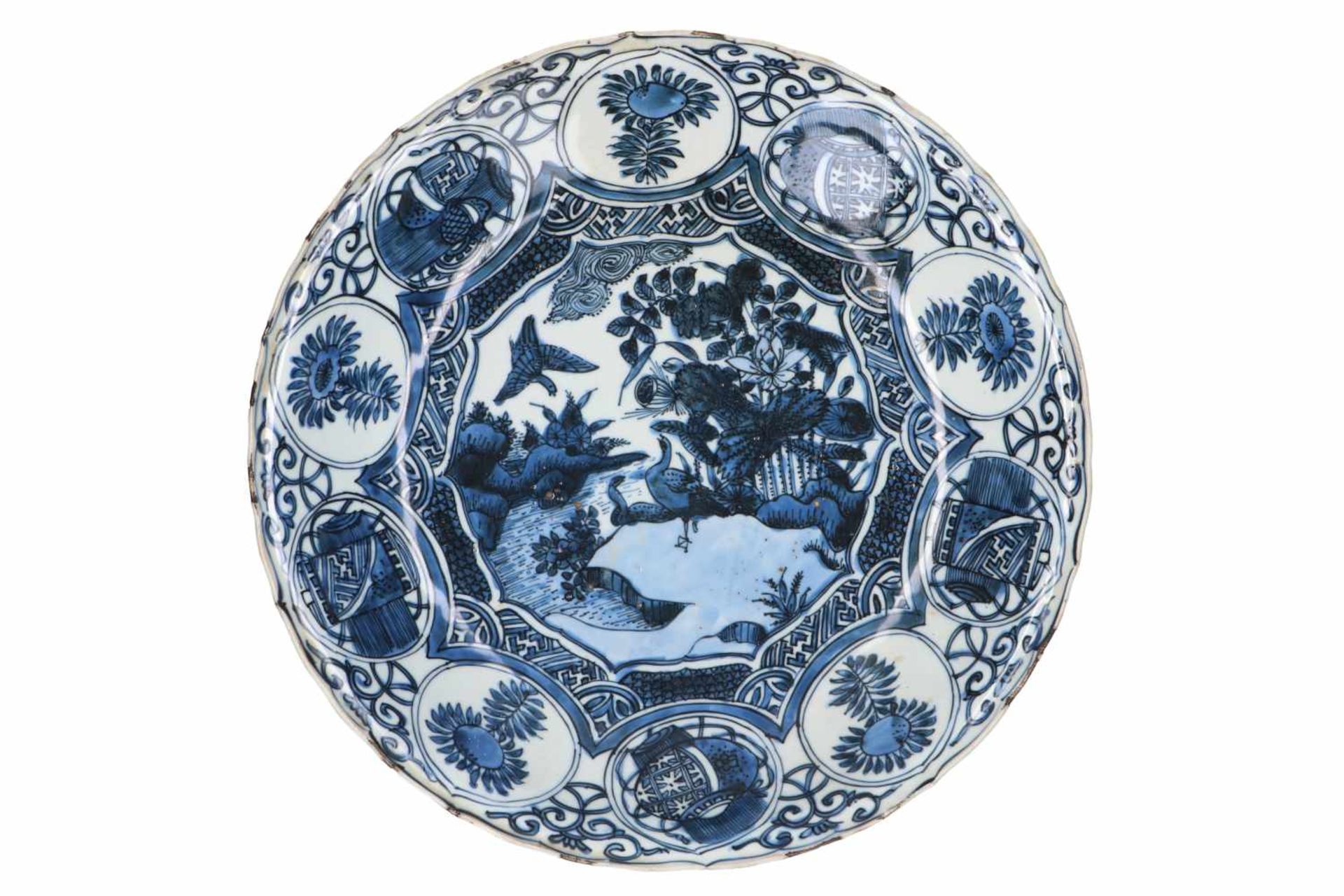 A blue and white 'kraak' porcelain deep charger, decorated with birds, flowers, fruits and