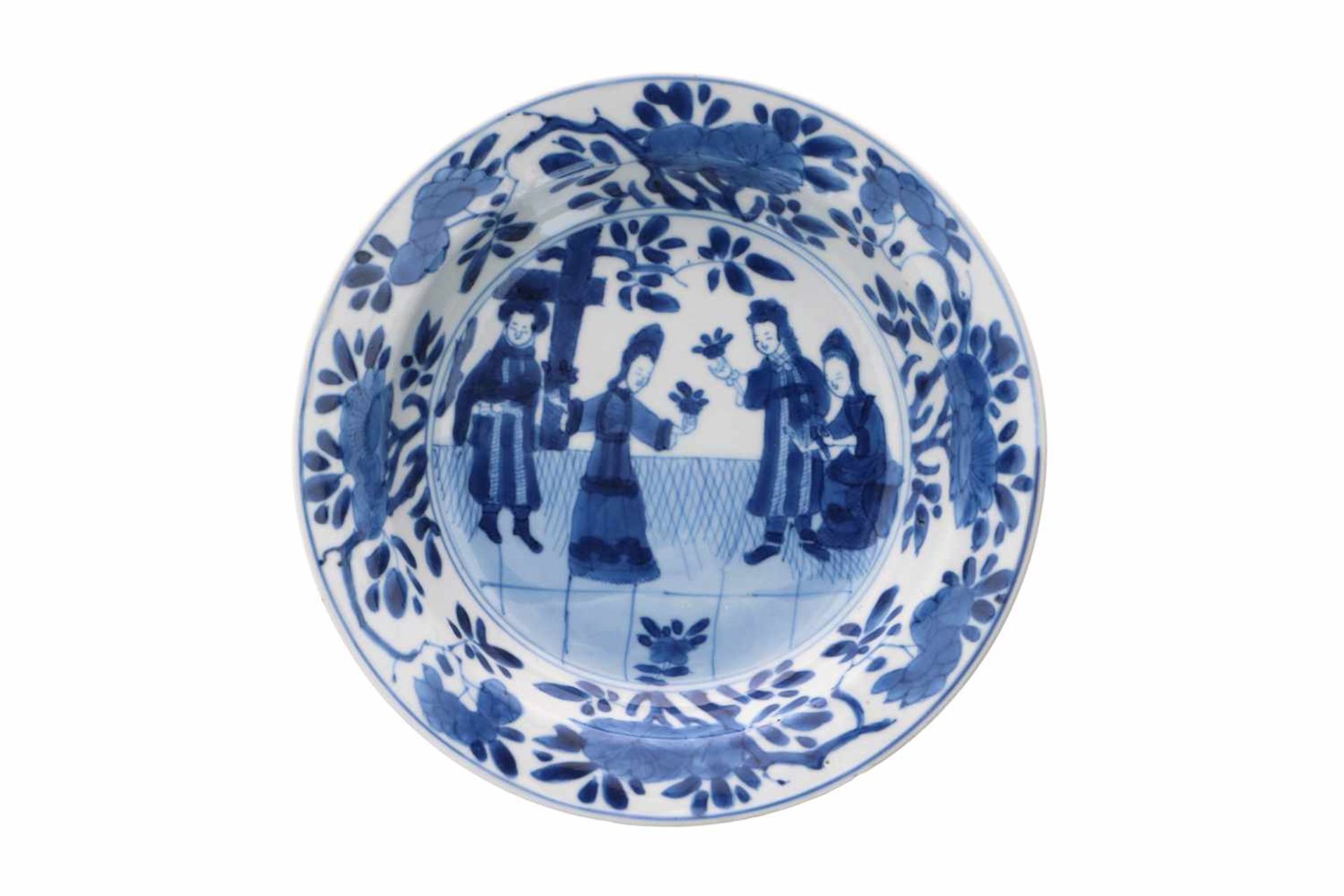 A blue and white Chine de Commande porcelain deep saucer, decorated with figures and flowers. Marked