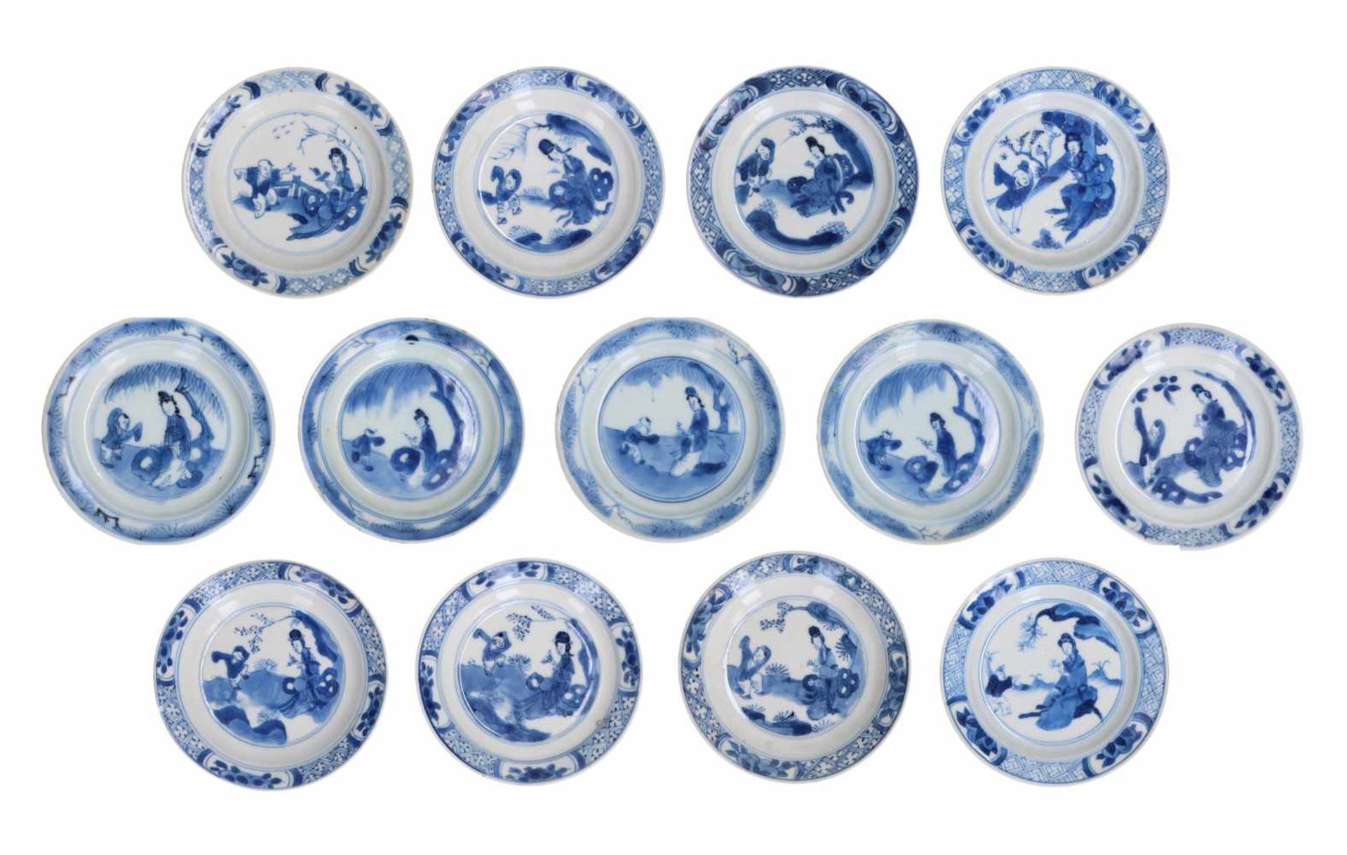 A set of 13 blue and white porcelain saucers, decorated with figures. Marked with 4-character