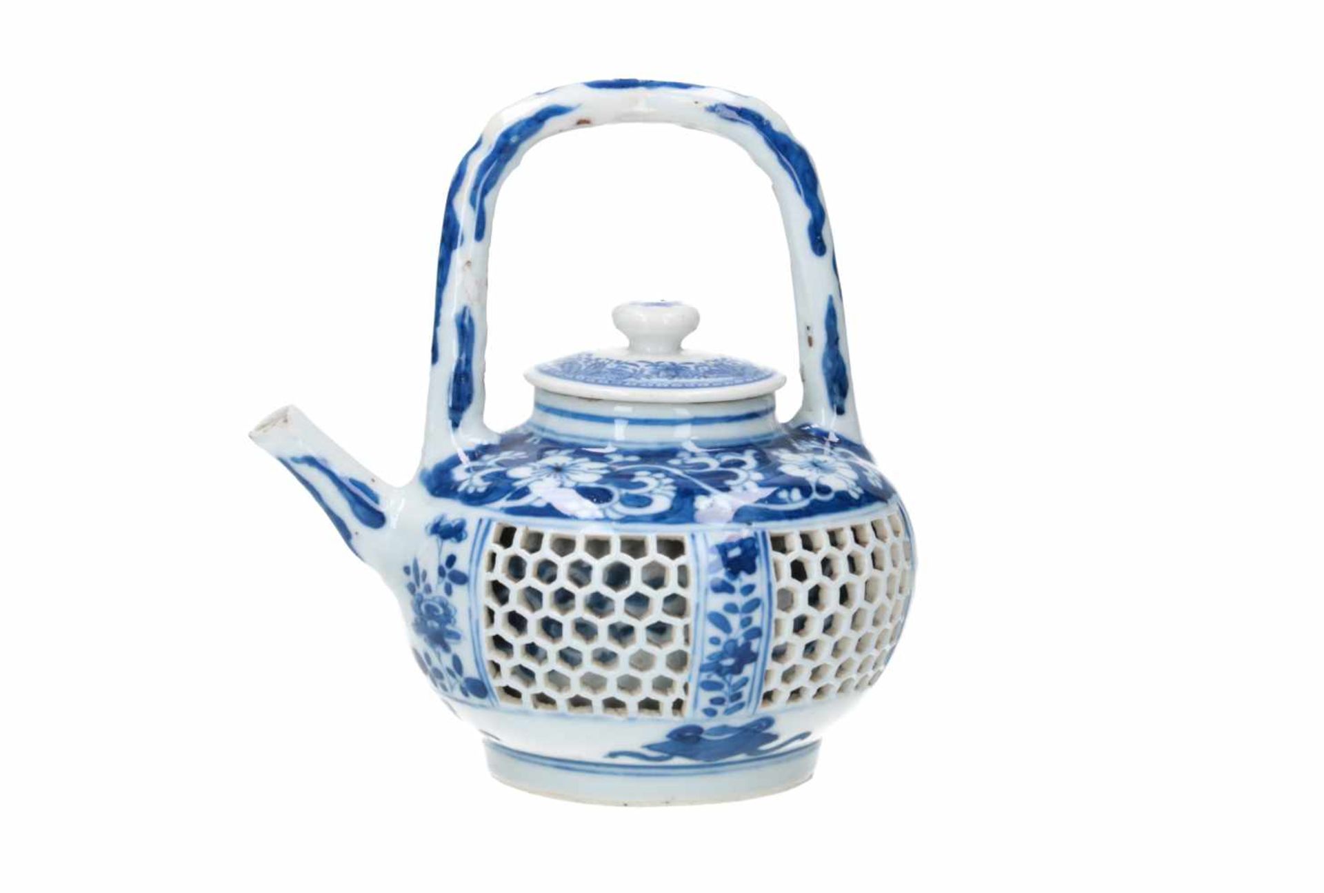 A blue and white porcelain teapot with open work belly, decorated with flowers and censers. Cover