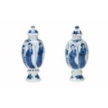 A pair of blue and white porcelain lidded miniature vases, decorated with long Elizas and flowers.