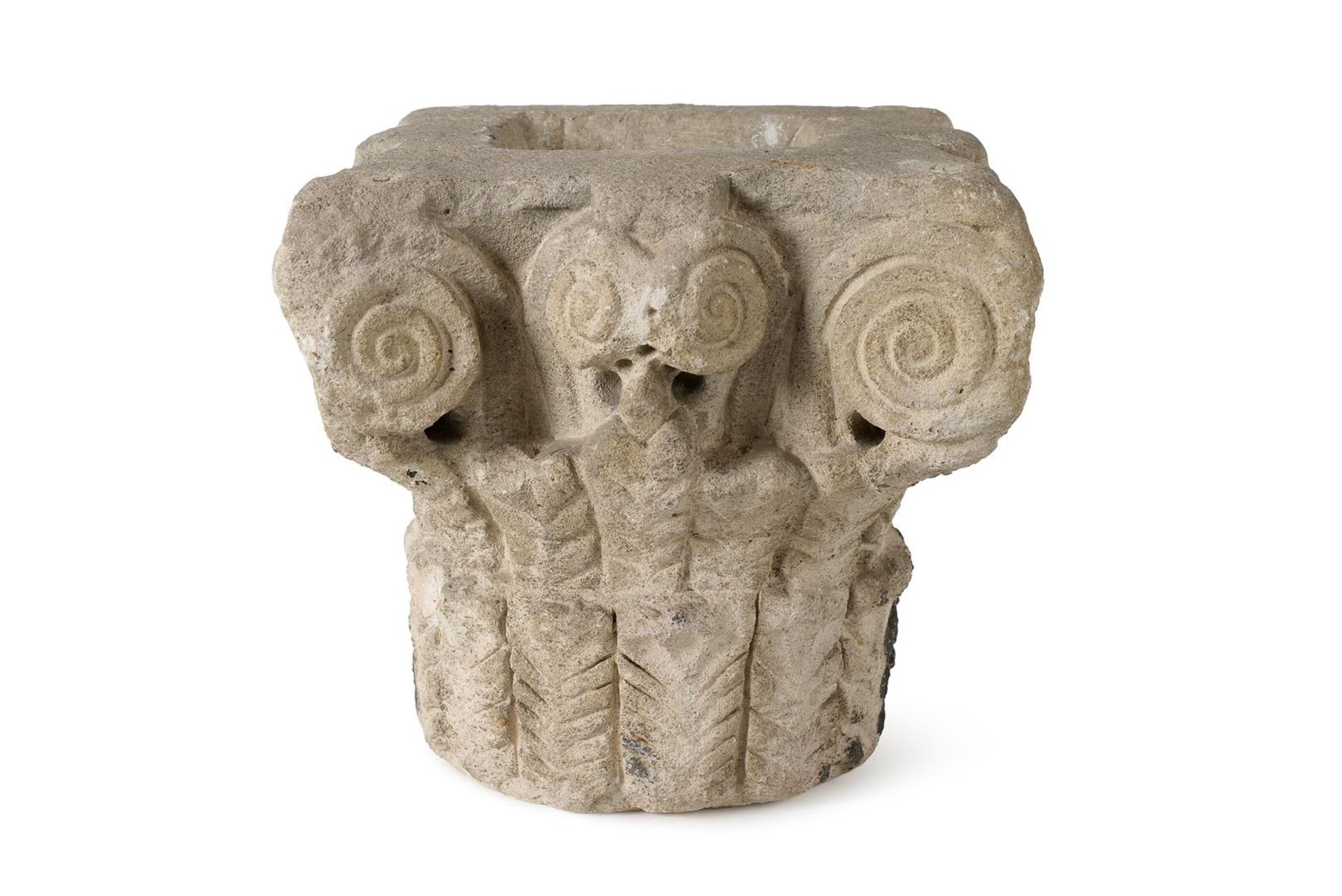 A French Romanesque carved sandstone capital. Approx. 12th/13th century. Provenance: Piasa, Paris. G
