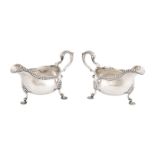 A pair of first grade silver sauce boats on three rocaille feet. London, 1765. Total weight approx.