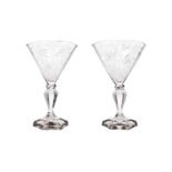 A pair of crystal fan-shaped vases on a faceted baluster base. The chalice with a finely cut decorat
