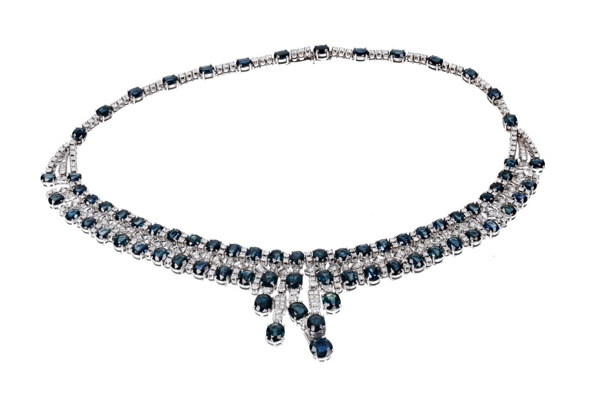 An 18-kt white golden necklace, set with 312 brilliant cut diamonds and 74 oval cut sapphires. 1960 - Image 3 of 4