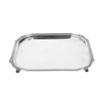 A first grade silver tray with rounded corners, on four legs. Total weight approx. 1050 g.