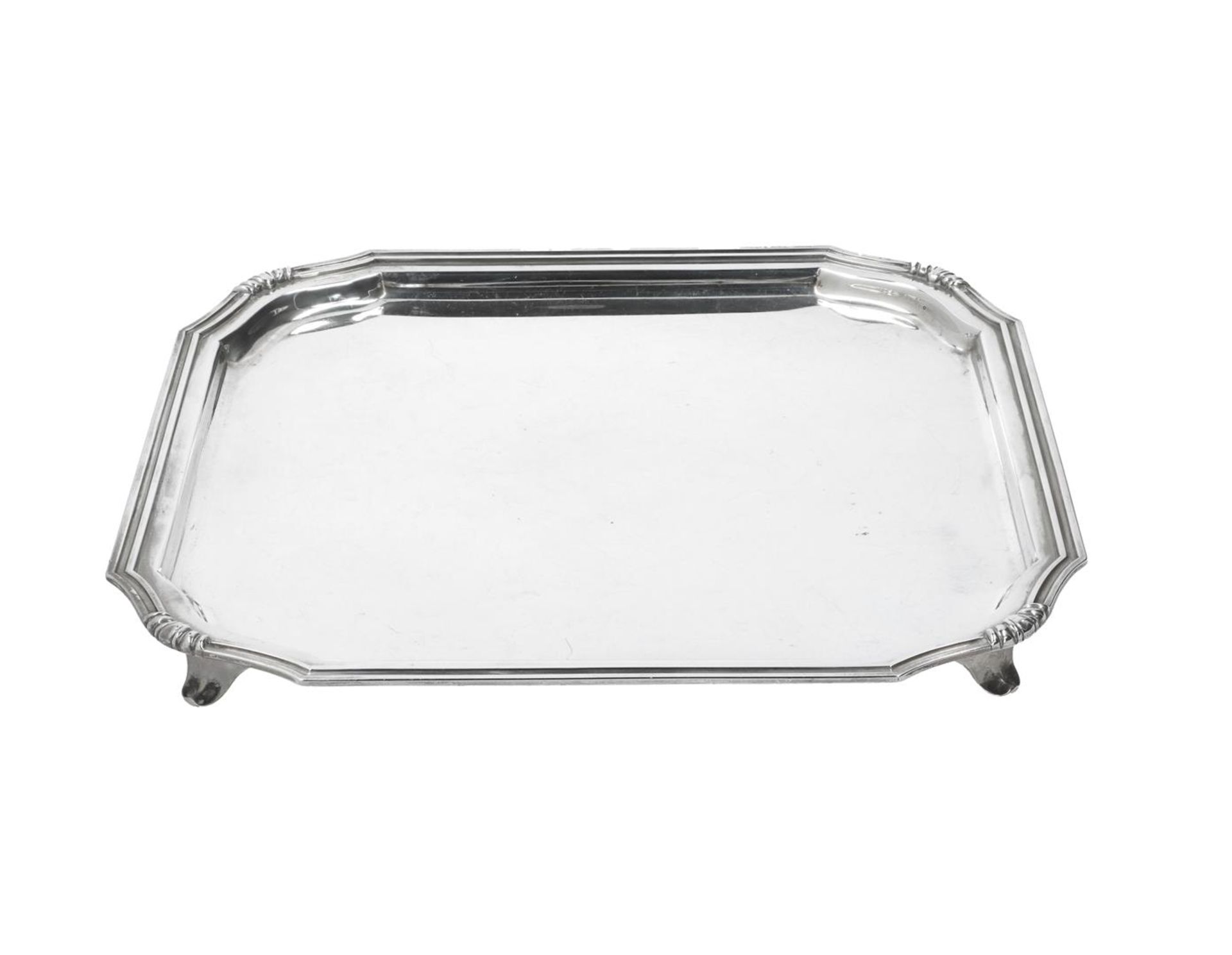 A first grade silver tray with rounded corners, on four legs. Total weight approx. 1050 g.