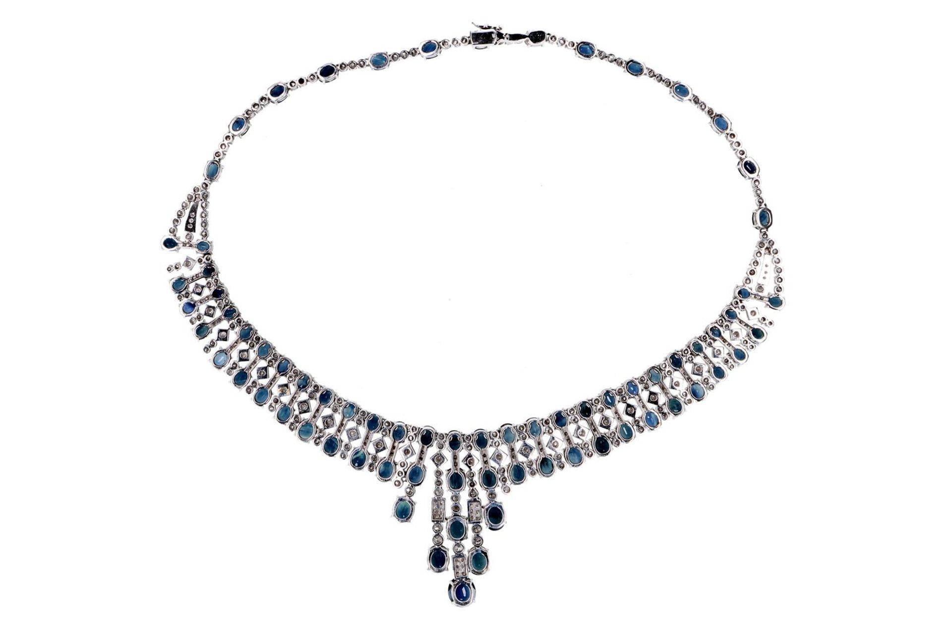 An 18-kt white golden necklace, set with 312 brilliant cut diamonds and 74 oval cut sapphires. 1960 - Image 4 of 4