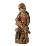 An oak sculpture of a pietà, with remains of polychromy. South-Germany, 15th century.