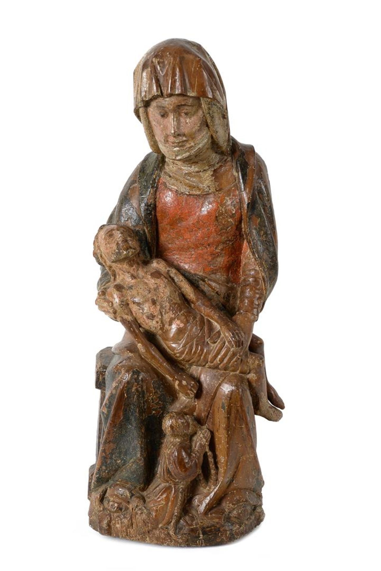 An oak sculpture of a pietà, with remains of polychromy. South-Germany, 15th century.