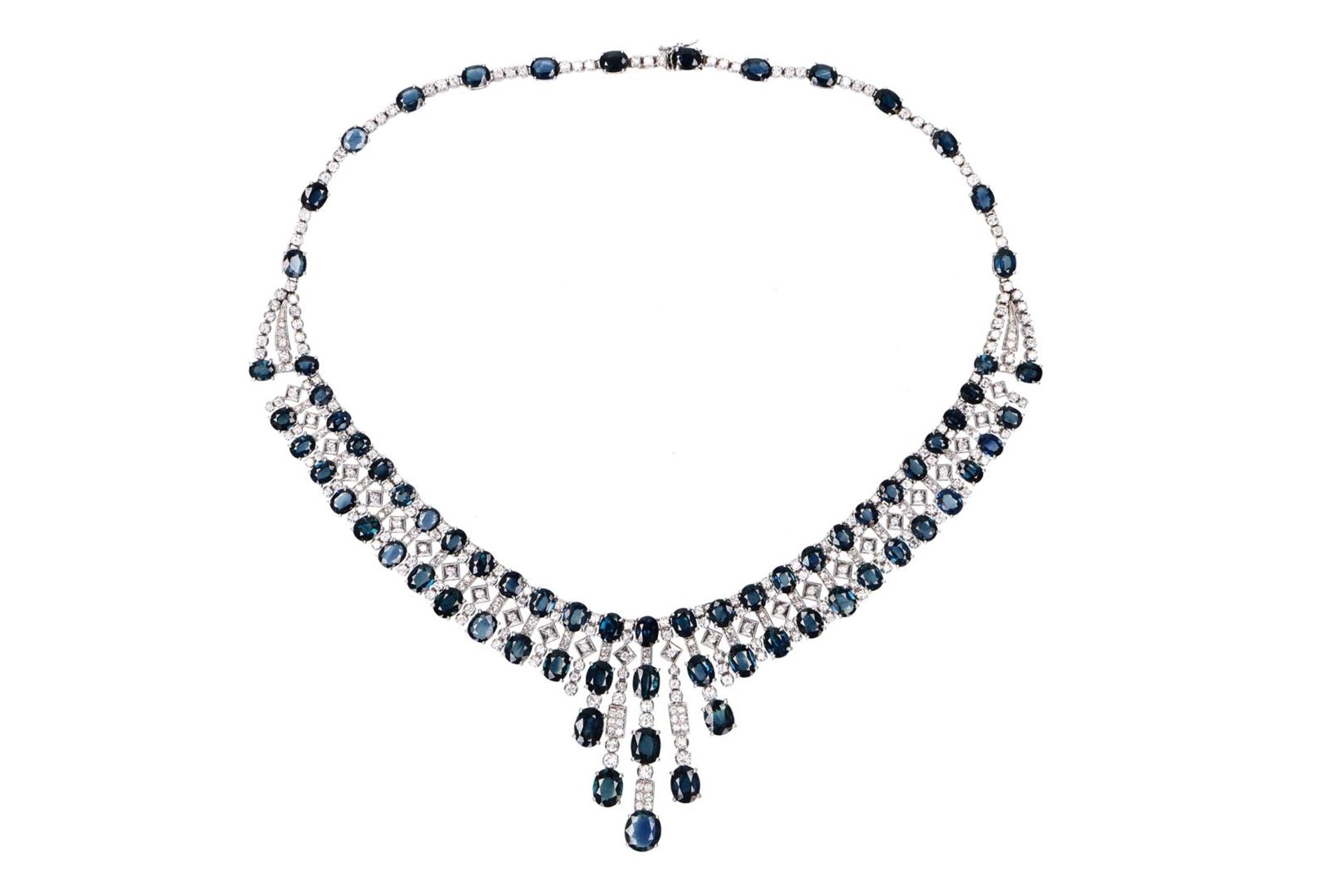 An 18-kt white golden necklace, set with 312 brilliant cut diamonds and 74 oval cut sapphires. 1960