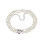 A three-strand cultured pearl necklace with an openwork 14-kt white golden clasp, set with 40 diamon