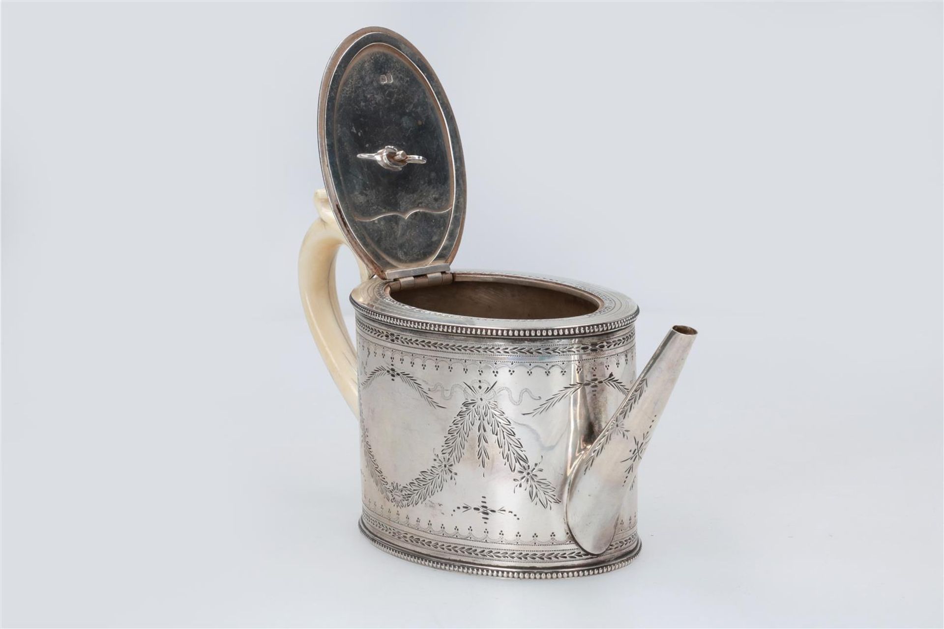 An oval first grade silver teapot with ivory handle and knob. With engraving of garlands. England, 1 - Image 3 of 4
