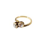 A 14-kt golden ring with two rose cut diamonds and six small rose cut entourage diamonds. Size 51 an
