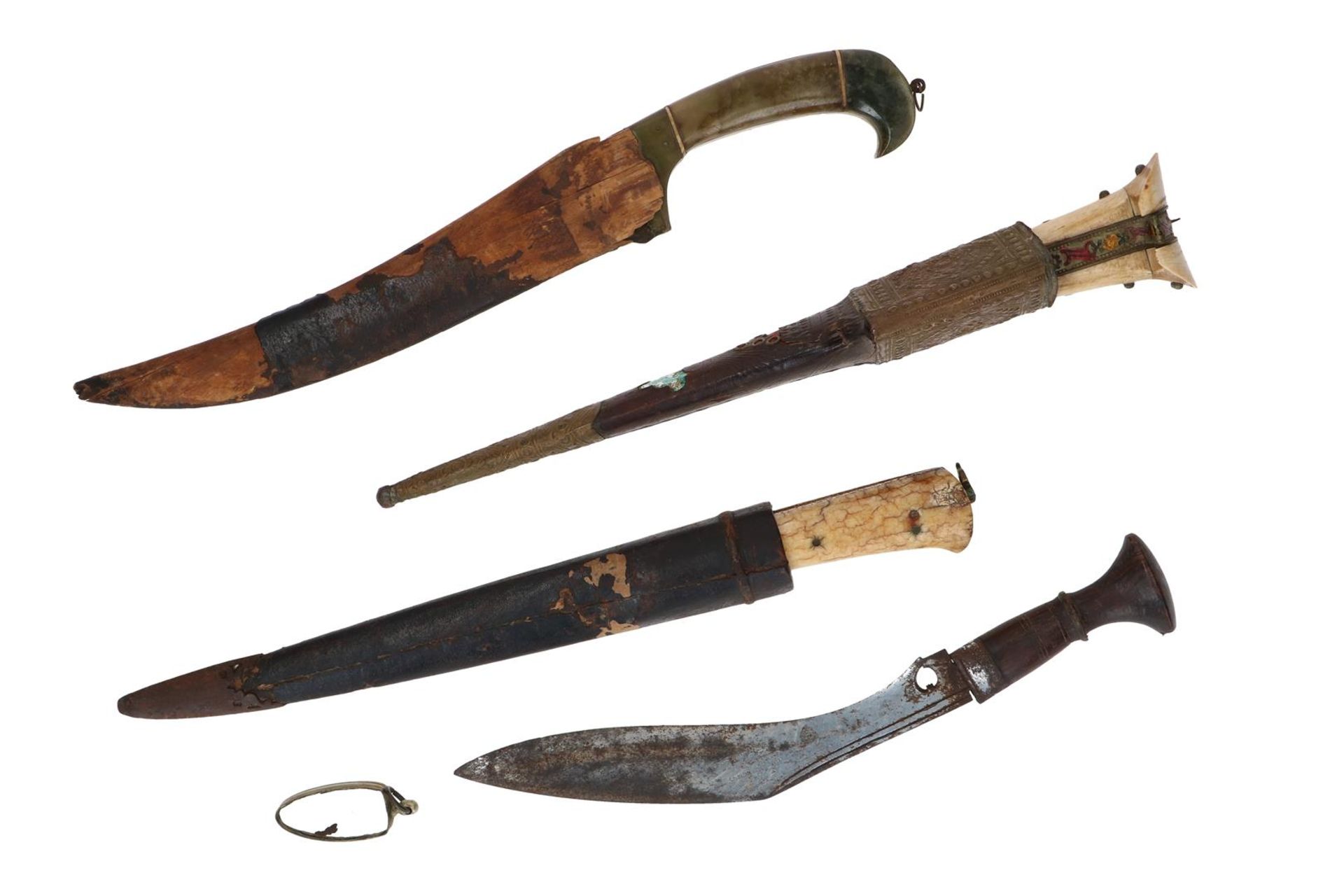 Lot of four diverse daggers, including Kadjar. The handles i.a. with ivory, gilding and jade. Three