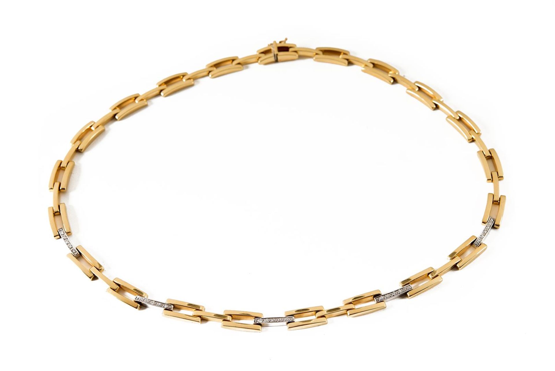 A 14-kt bicolor golden choker set with 25 brilliant-cut diamonds of each approx. 0.01 ct. L. 44.5 cm