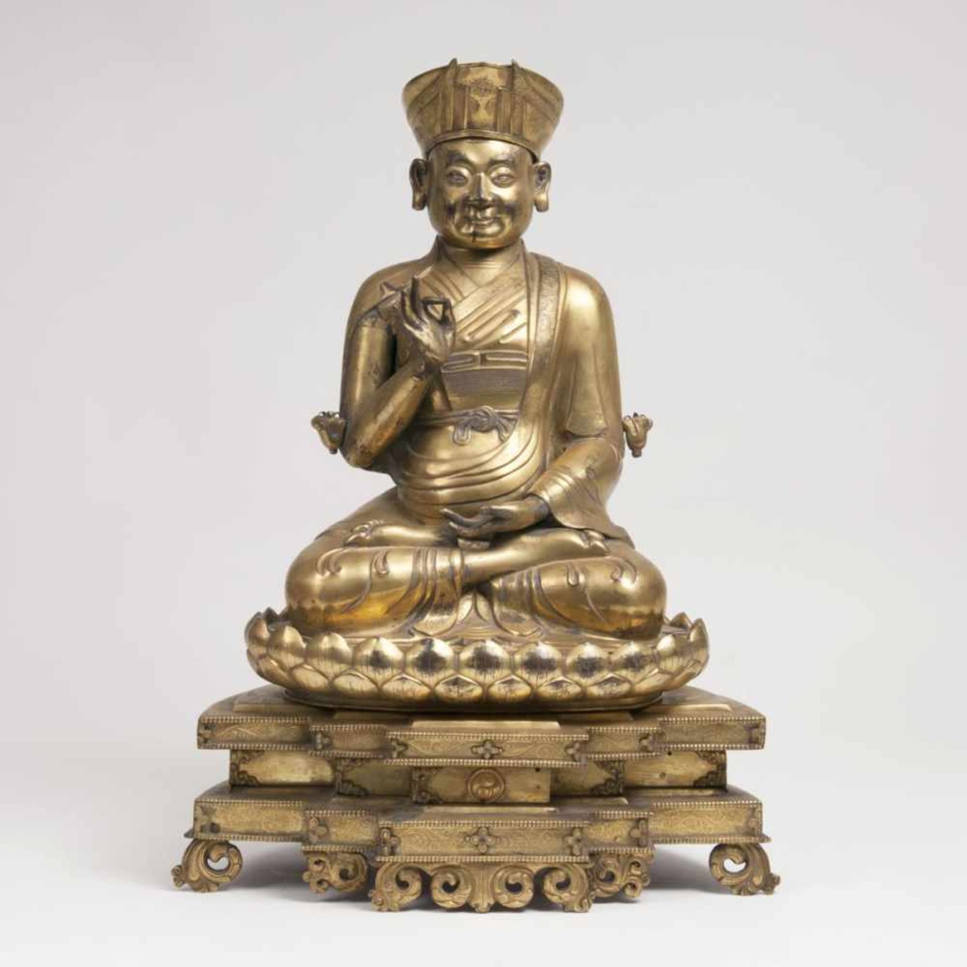 A Highly Important Repoussé Figure of a Sitting Lama<