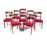 A SET OF EIGHT REGENCY MAHOGANY DINING CHAIRS Comprising: a carver and seven side chairs, each