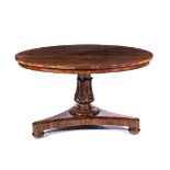 A WILLIAM IV ROSEWOOD TABLE The circular top above a leaf-carved support, gadrooned collar on a