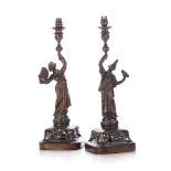 A PAIR OF CHINOISERIE BRONZE FIGURAL TABLE LAMPS The male and female figures clothed in typical