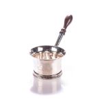 A SILVER BRANDY WARMER Everted rim, turned wooden handle on a reeded foot-ring10cm diameter, 180g