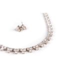 A DIAMOND NECKLACE AND EARRINGS Designed as a line of trefoil-shaped links, graduated in size,