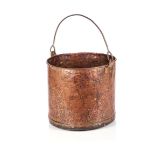 A HAMMERED-COPPER BUCKET Of cylindrical form with swing handle33cm diameter
