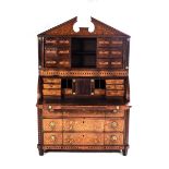 A DUTCH MARQUETRY CYLINDER BUREAU, 19TH CENTURY In two parts, the moulded broken pediment above a