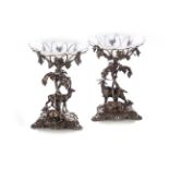 TWO VICTORIAN CAST CENTREPIECES Each respectively modelled as a pair of deer and a pair of goats