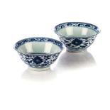 A NEAR PAIR OF CHINESE BLUE AND WHITE ‘LOTUS’ BOWLS, QING DYNASTY, 19TH CENTURY Each bell-shaped