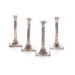 A SET OF FOUR GEORGE III SILVER CANDLETICKS, JOSEPH SMITH I, LONDON, 1771 Each modelled as a