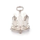 A GEORGE III SILVER AND CUT-GLASS CRUET SET, ROBERT GREY AND SON, EDINBURGH, 1818 The circular frame