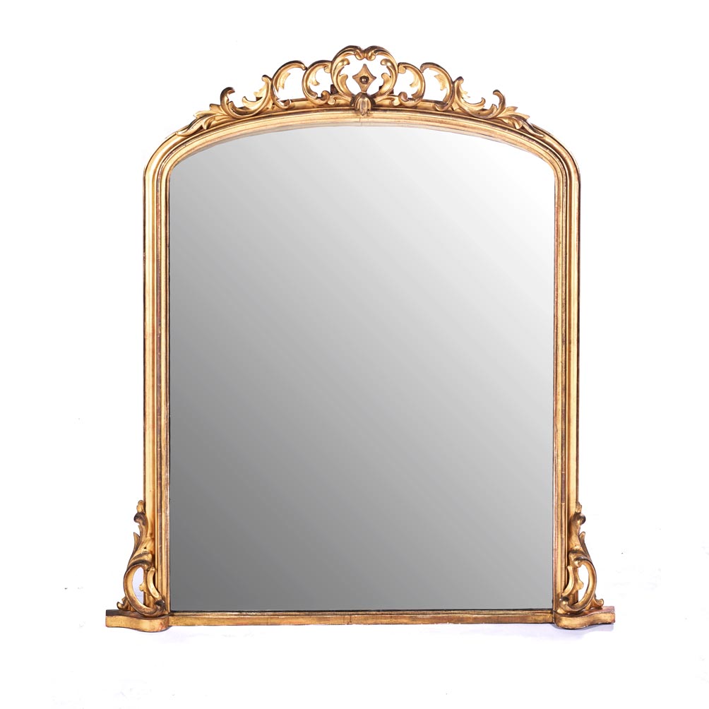 A GILTWOOD MIRROR, 19TH CENTURY The arched plate within a conforming moulded frame surmounted by